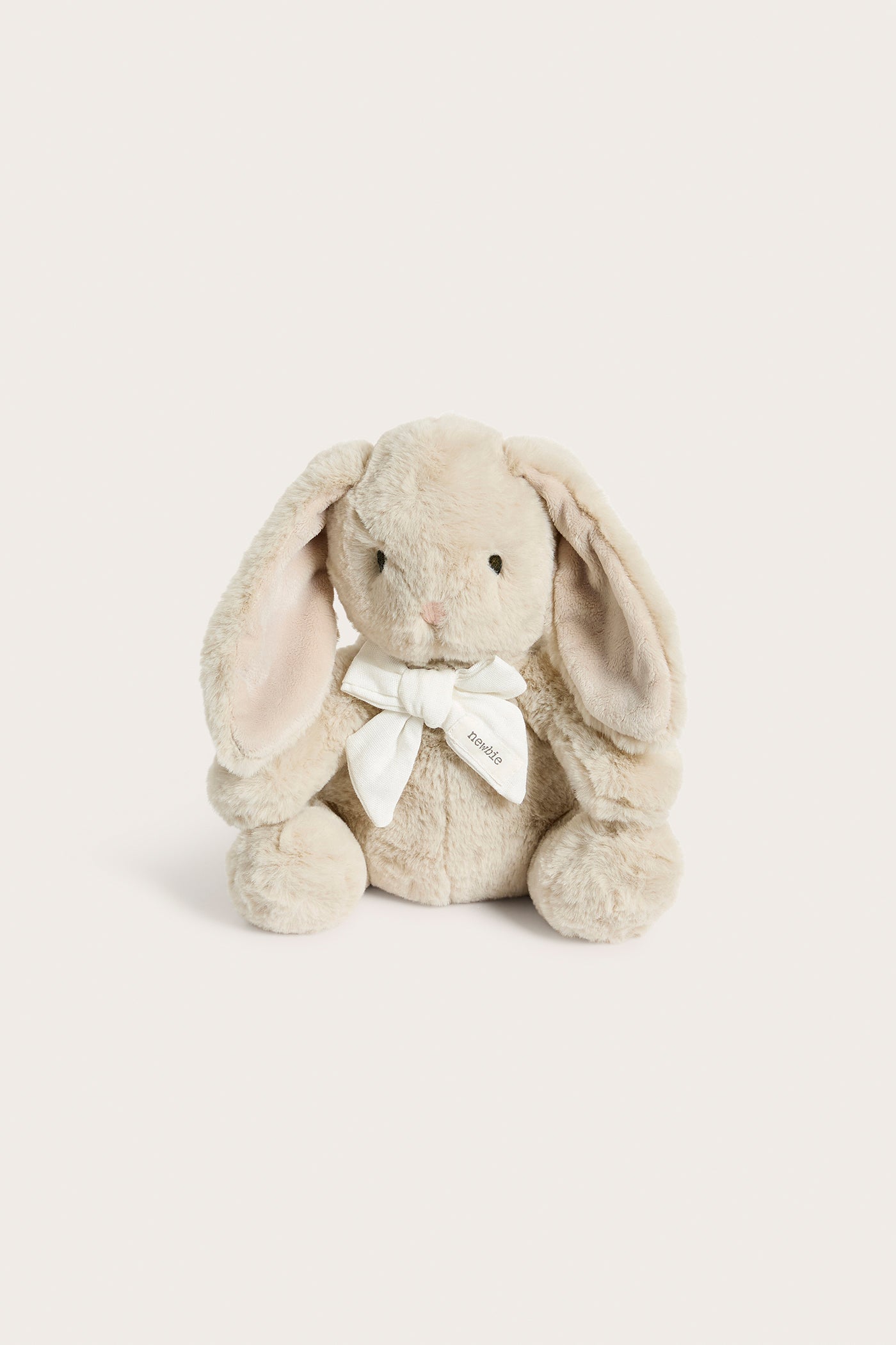 Beige soft toy bunny rabbit with bow