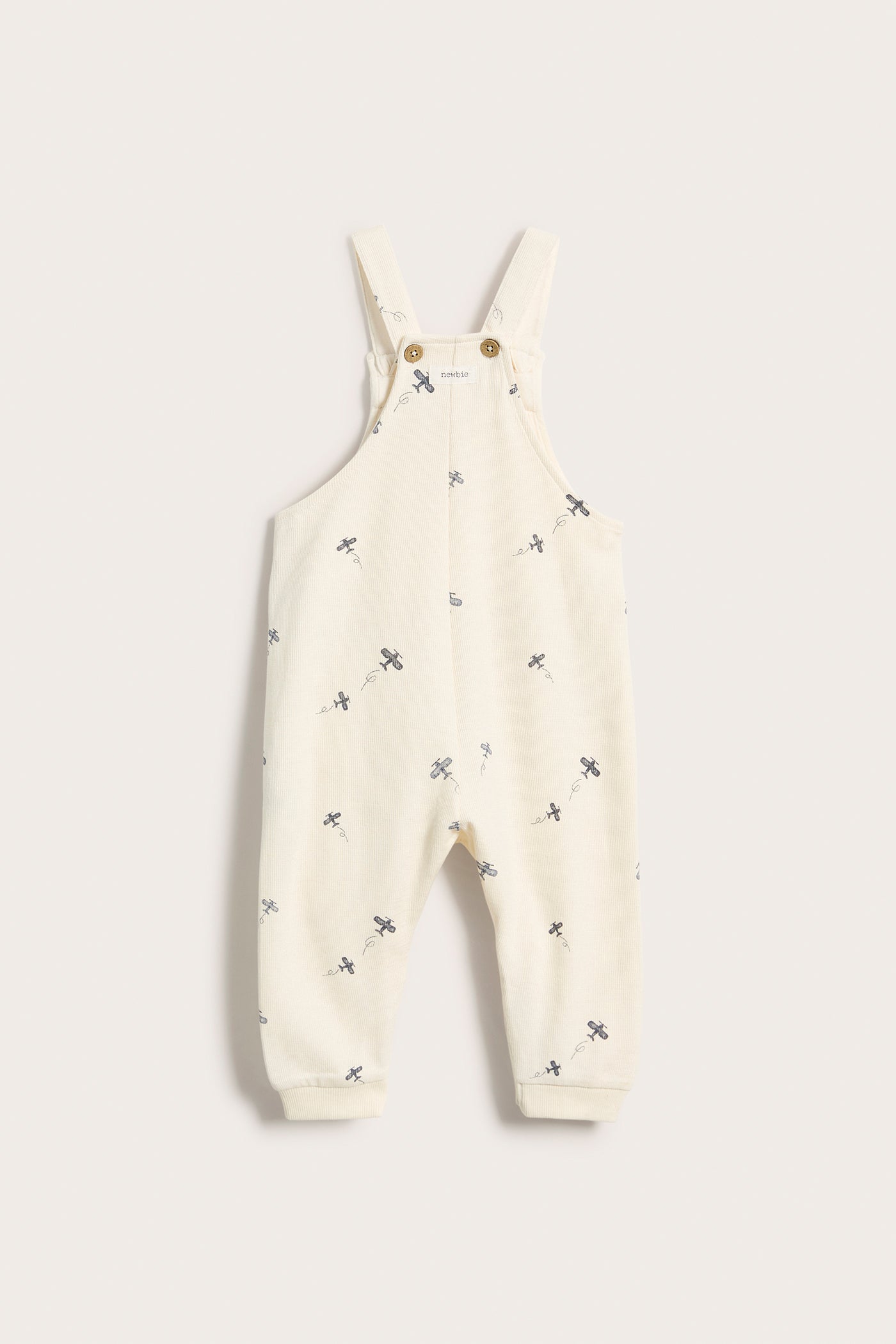 Baby white airplane patterned overalls